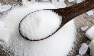 Expositor de alimentos em mercado internacional, representando a queda nos preços globais